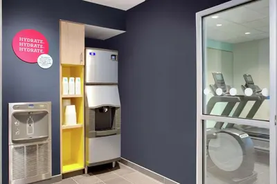 a bathroom with a refrigerator and a toilet in a store at Tru By Hilton Audubon Valley Forge in Audubon