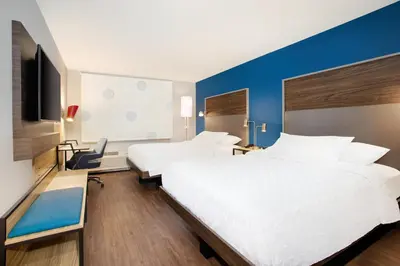 a hotel room with two beds and a tv at Tru By Hilton Audubon Valley Forge in Audubon