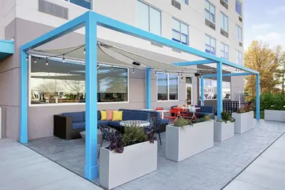a pergola on the side of a building at Tru By Hilton Audubon Valley Forge in Audubon