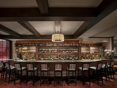 a bar with a lot of bottles of alcohol at Penn's View Hotel Philadelphia in Philadelphia