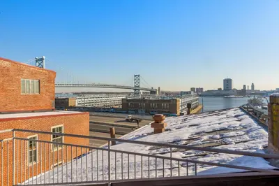 a view of the brooklyn bridge from the roof of a building at Penn's View Hotel Philadelphia in Philadelphia
