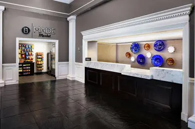 a store lobby with blue vases on the wall at The Desmond Hotel Malvern, a DoubleTree by Hilton in Malvern