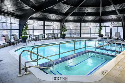 a large swimming pool in a building at The Desmond Hotel Malvern, a DoubleTree by Hilton in Malvern