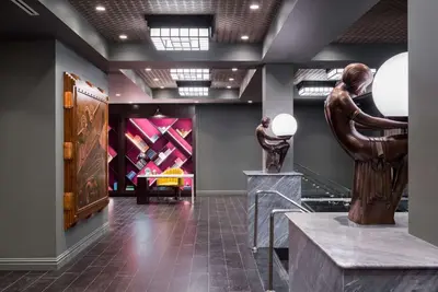 a museum with a statue of a woman on a table at TRYP by Wyndham Newark Downtown in Newark