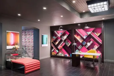 a room with a wall full of wine bottles at TRYP by Wyndham Newark Downtown in Newark