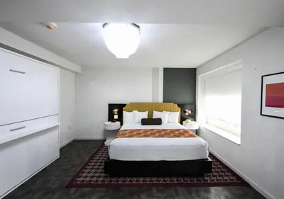 a bedroom with a large bed in a room at TRYP by Wyndham Newark Downtown in Newark