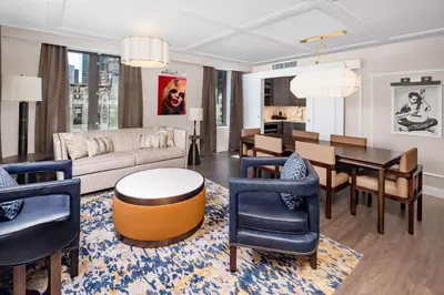 a living room with a couch and a table at Hilton Club The Quin New York in New York