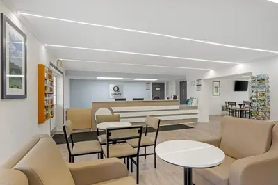 a waiting area with tables and chairs in a waiting room at Quality Inn Smoketown - Lancaster Area in Smoketown