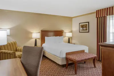 a hotel room with a bed and a desk at Best Western PLUS Morristown Inn-Florham Park in Morristown