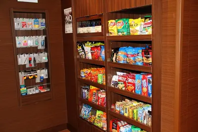 a room with shelves filled with food and snacks at Fairfield by Marriott Inn & Suites Jonestown Lebanon Valley in Jonestown