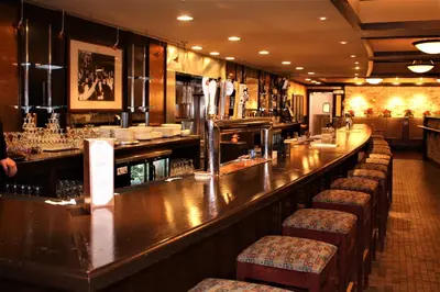 a bar in a restaurant with stools at Waynebrook Inn in Honey Brook