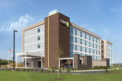 a hotel building with a hilton sign on it at Home2 Suites By Hilton Harrisburg Hershey in Harrisburg