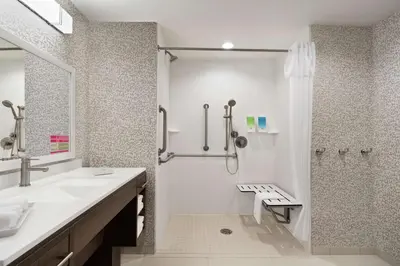 a bathroom with a shower and a sink and a toilet at Home2 Suites By Hilton Harrisburg Hershey in Harrisburg