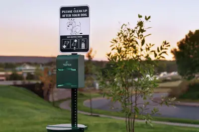 a sign sitting on top of a pole in the grass at Home2 Suites By Hilton Harrisburg Hershey in Harrisburg