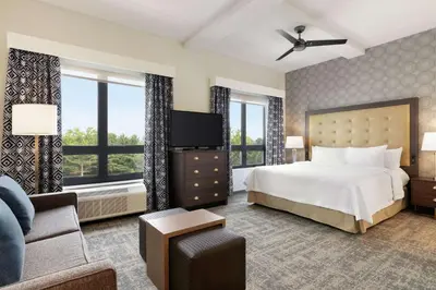 a hotel room with a bed and a couch at Homewood Suites By Hilton Horsham Willow Grove in Horsham