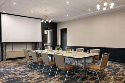 a conference room with a table and chairs and a projection screen at Homewood Suites By Hilton Horsham Willow Grove in Horsham