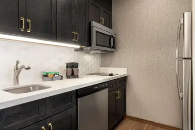 a kitchen with a sink and a microwave at Homewood Suites By Hilton Horsham Willow Grove in Horsham