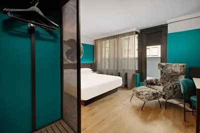 a hotel room with a bed and a chair at Hyatt Centric Midtown 5th Avenue New York in New York