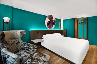 a bedroom with a bed and a chair at Hyatt Centric Midtown 5th Avenue New York in New York