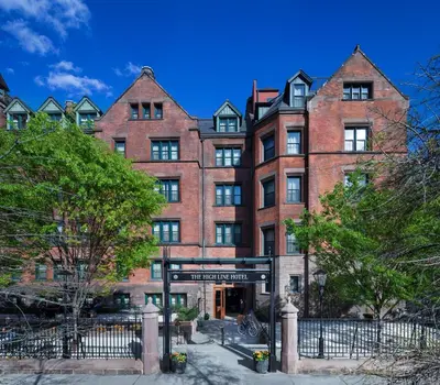 a large brick building with a sign in front of it at The High Line Hotel in New York