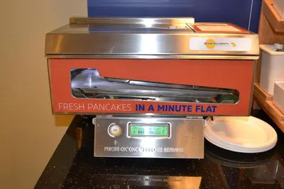 a sign that reads fresh pancakes in a minute flap next to a toilet at Holiday Inn Express Selinsgrove by IHG in Shamokin Dam