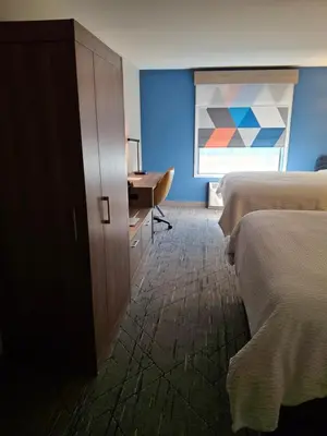 a room with two beds and a desk and a window at Holiday Inn Express Selinsgrove by IHG in Shamokin Dam