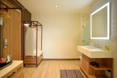 a bathroom with a sink and a mirror at Wyndham Garden North Bergen - Secaucus in North Bergen