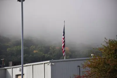 an american flag flying on top of a building at Relax Inn in Fisherville