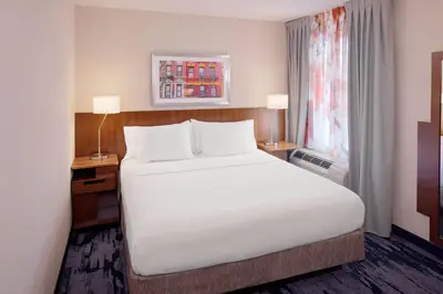 a bedroom with a large white bed and a window at Fairfield Inn & Suites New York Manhattan/Downtown East in New York