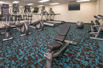 a gym with treadmills and cardio machines at Fairfield Inn & Suites New York Manhattan/Downtown East in New York
