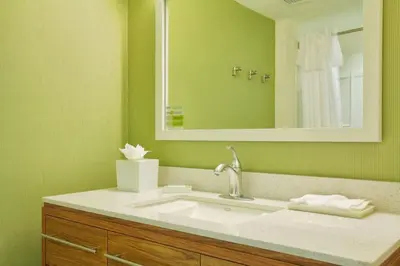 a bathroom with a sink and a mirror at Home2 Suites by Hilton Rahway in Rahway