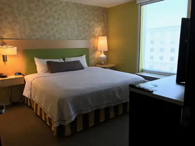 a bedroom with a large bed and a window at Home2 Suites by Hilton Rahway in Rahway