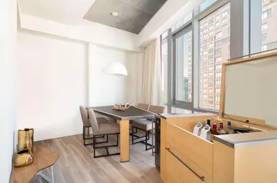 a dining room with a table and chairs and a chalkboard at Hyatt Union Square New York in New York