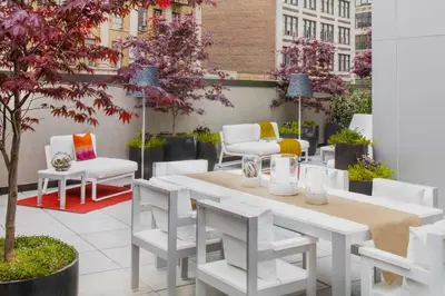 a patio with a white table and chairs at Hyatt Union Square New York in New York
