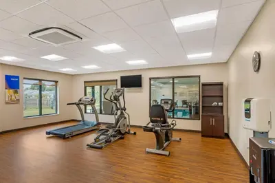 a gym with two treadmills and two machines at Comfort Inn & Suites Gap Amish Country in Gap