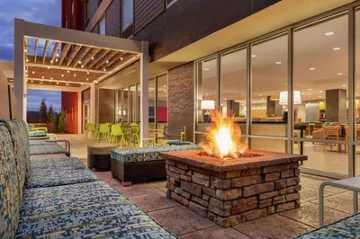 a fire pit in the middle of a patio at Home2 Suites By Hilton Glen Mills Chadds Ford in Glen Mills