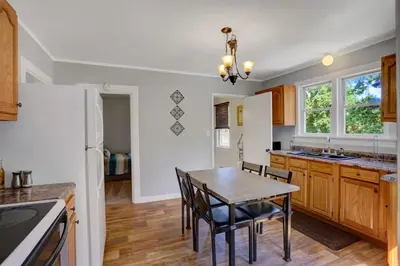 a kitchen with a table and chairs in a kitchen at Stay On State - 15 Min to Harrisburg, 30 Min to Carlisle 2BR tastefully decorated in Duncannon