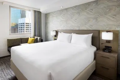 a bedroom with a large white bed and a window at Residence Inn New York Downtown Manhattan/Financial District in New York