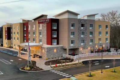 an aerial view of a hotel with a parking lot at TownePlace Suites by Marriott Clinton in Clinton