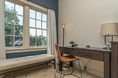 a room with a desk and a desk and a window at Ghost Light Inn in New Hope