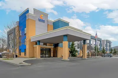a office building with a sign in front of it at Comfort Inn & Suites Sayre in Sayre