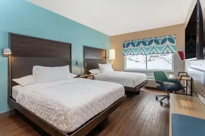 a hotel room with two beds and a window at Tru By Hilton Binghamton Vestal in Vestal