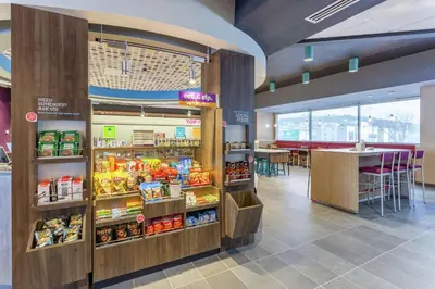a fast food restaurant with a large display of food at Tru By Hilton Binghamton Vestal in Vestal