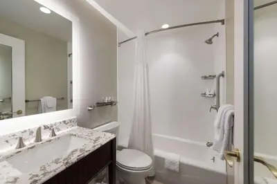 a bathroom with a tub and a toilet and a sink at Independence Park Hotel, BW Premier Collection in Philadelphia