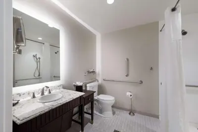 a white bathroom with a sink and a toilet at Independence Park Hotel, BW Premier Collection in Philadelphia