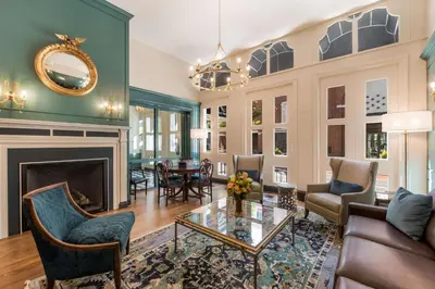 a living room filled with furniture and a fireplace at Independence Park Hotel, BW Premier Collection in Philadelphia
