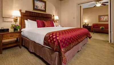 a hotel room with a large bed and a chair at Casablanca Hotel by Library Hotel Collection in New York