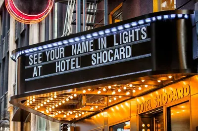a sign that says see your name in lights at hotel shored at Hotel Shocard Broadway, Times Square in New York