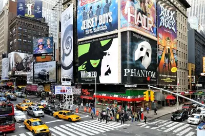 a busy city street with cars and taxis on a busy street at Hotel Shocard Broadway, Times Square in New York