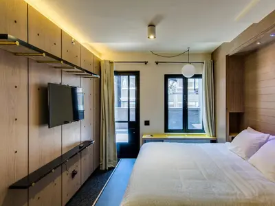 a bedroom with a bed and a flat screen tv at Hotel Shocard Broadway, Times Square in New York